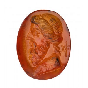 A Roman carnelian intaglio. Bust of an herm.