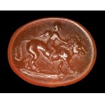 A Roman carnelian intaglio. Eros on a lion.