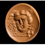 A roman lapis lazuli magical intaglio. Gorgona mask with torch
