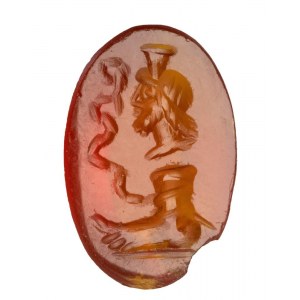 A Roman magical carnelian intaglio. Serapis with foot and snake.