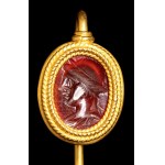 A Roman carnelian intaglio set in a gold stick pin. Apollo.