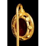 A Roman carnelian intaglio set in a gold stick pin. Apollo.