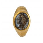 A Roman gold ring set with a nicolo intaglio. Head of Dyonisus.