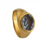 A Roman gold ring set with a nicolo intaglio. Head of Dyonisus.