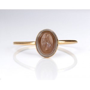 A small Roman agate intaglio set in a later gold ring. Fortuna-Tyche.