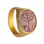 A Roman gold ring with a jasper intaglio. Menorah with attributes.