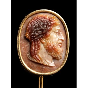A three-layered agate cameo set in a gold stick pin. Bust of Zeus.