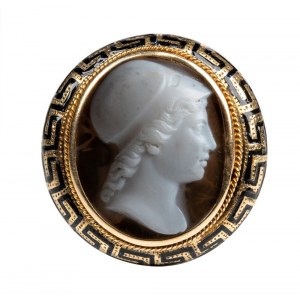 A Neoclassical agate cameo set in a gold and black enamel ring.