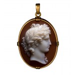 An early Victorian agate cameo set in a gold pendant. Laureated head of Apollo.