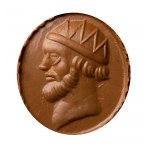 A postclassical carnelian intaglio set in a later silver ring. Male head.
