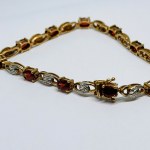 Złota bransoletka z naturalnymi Granatami oraz Diamentami około 0.22 Ct