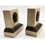 Two Roman-style book coasters with designs of emperors