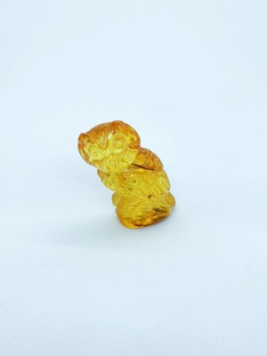 Hand carved owl figurine of natural transparent Baltic amber