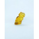 Hand carved owl figurine of natural transparent Baltic amber