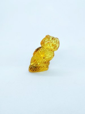 Hand carved owl figurine of natural transparent Baltic amber