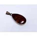Silver pendant with amber
