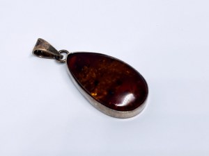 Silver pendant with amber