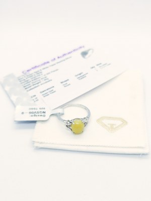 Ring with 1 green opal 2.16 ct, 2 white topazes 0.02 ct, 925 silver, RocksTV certificate