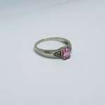 Silver ring with white sapphires and pink zirconia