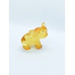 Hand-carved translucent elephant figurine made of natural Baltic amber