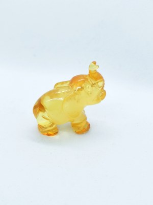Hand-carved translucent elephant figurine made of natural Baltic amber