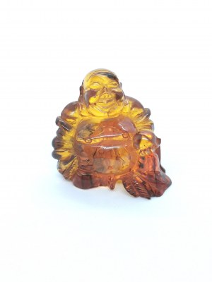 Hand-carved transparent Buddha figurine made of natural Baltic amber