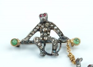 Silver, gold, diamond, emerald, ruby, Victorian inspired swinging monkey brooch