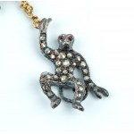 Silver, gold, diamond, emerald, ruby, Victorian inspired swinging monkey brooch