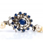 Pearl necklace and gold brooch with diamonds and sapphires