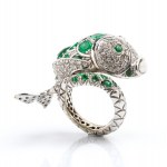 Gold fish-shaped ring with diamonds and emeralds
