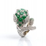 Gold fish-shaped ring with diamonds and emeralds