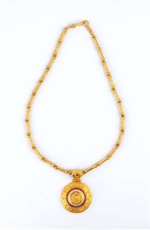 Gold archaeological-style necklace with precious stones