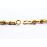 Gold archaeological-style necklace with precious stones