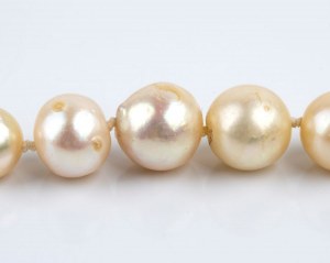 Gold, silver, diamond, emerald long pearl necklace