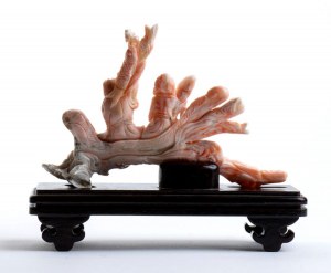 A PINK CORAL SCULPTURE
