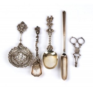 A goup of four silver spoons and a pair of scissors