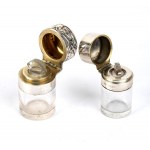 A pair of cut crystal and sterling silver bottles
