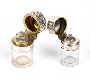 A pair of cut crystal and sterling silver bottles