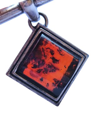 Silver brooch with natural Baltic amber