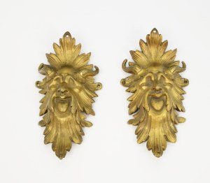 A pair of fittings - mascarons with satyr features