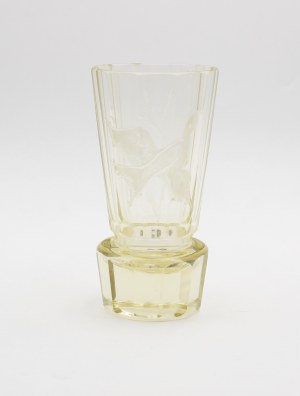 Glass with a flying bird among the grasses