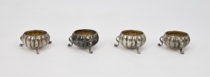 Salt cellars knocked on curved legs with monogram 
