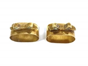 A pair of decorative napkin rings