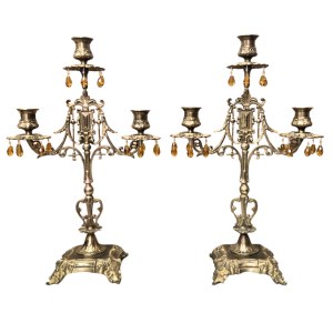 A pair of decorative candle holders