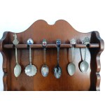 Set of collectible spoons in a wooden display case