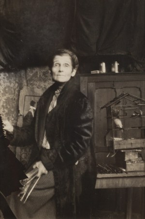Olga Boznanska by the cage with a parrot in her studio at 49 Boulevard Montparnasse, 1930s.