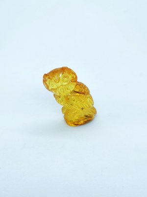 Hand-carved owl figurine of natural transparent Baltic amber