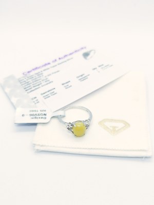 Ring with 1 green opal 2.16 ct, 2 white topazes 0.02 ct, 925 silver, RocksTV certificate