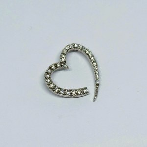 Silver pendant in the form of a heart with white zircons
