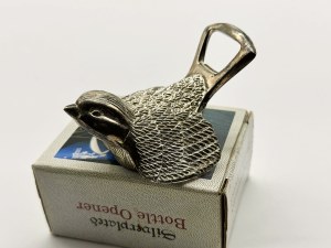 Silver-plated opener in the form of a bird in original packaging